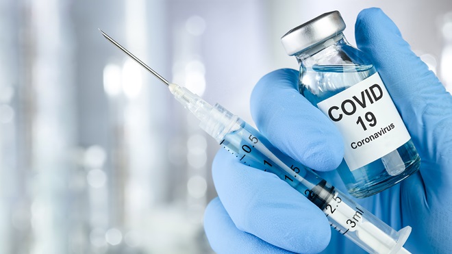 Hand holding Covid-19 vaccine
