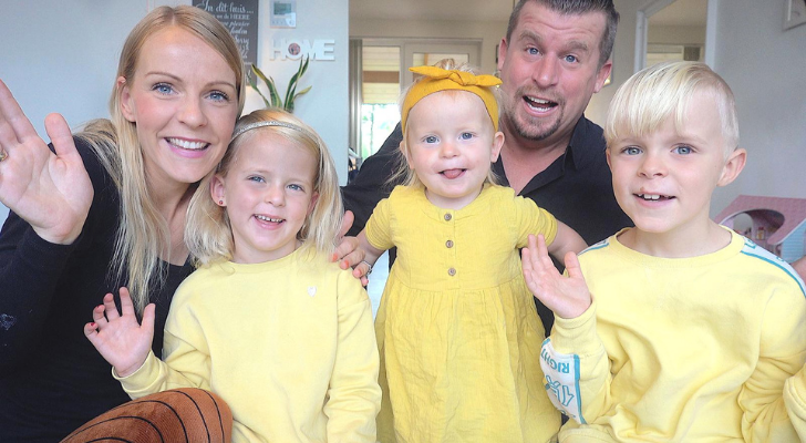 A Dutch social media family posing in front of the camera.