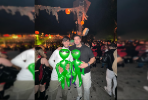 Visitors with plastic martians as a costume